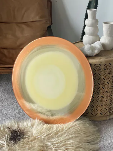 An original circular painting by New Zealand artist Hollie O'Neill, available at The Little Gallery Whangamata